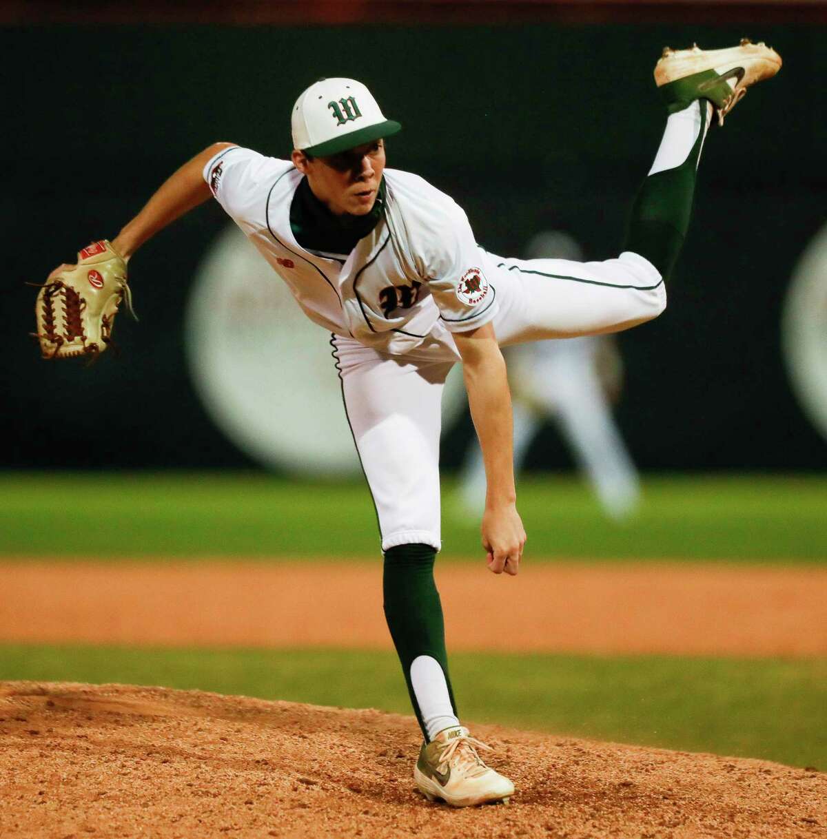 The Woodlands pitcher Brayden Sharp (21), shown here last season, pitched a perfect game at Conroe Wednesday night.