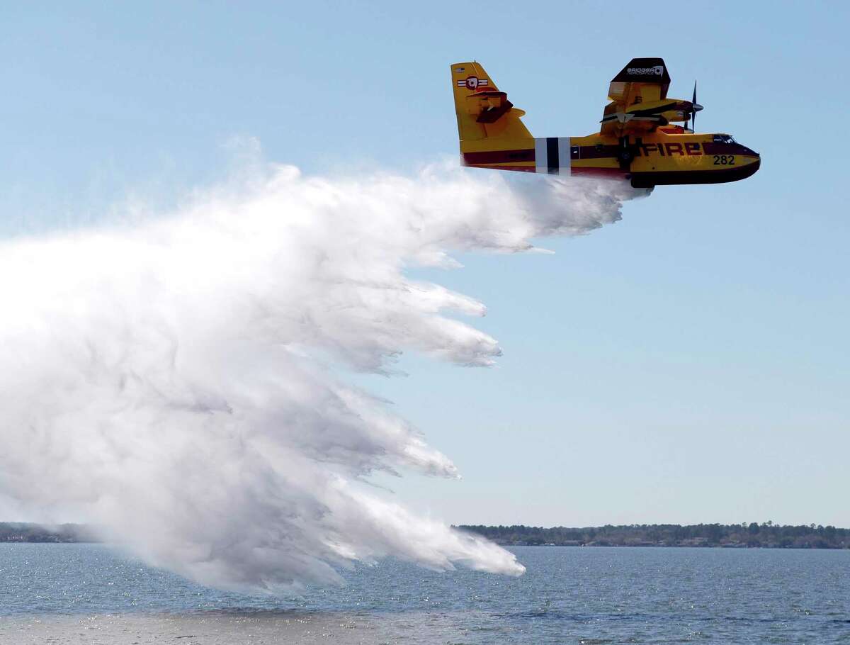 Bridger Aerospace demonstrated their new fully amphibious aircraft used for aerial firefighting over Lake Conroe, Wednesday Feb. 9, 2022. Montgomery County fire departments have taken the call to ward off further wildfire devastation throughout the state amid the 55,000 acres ravaged by the Eastland Complex Fire.