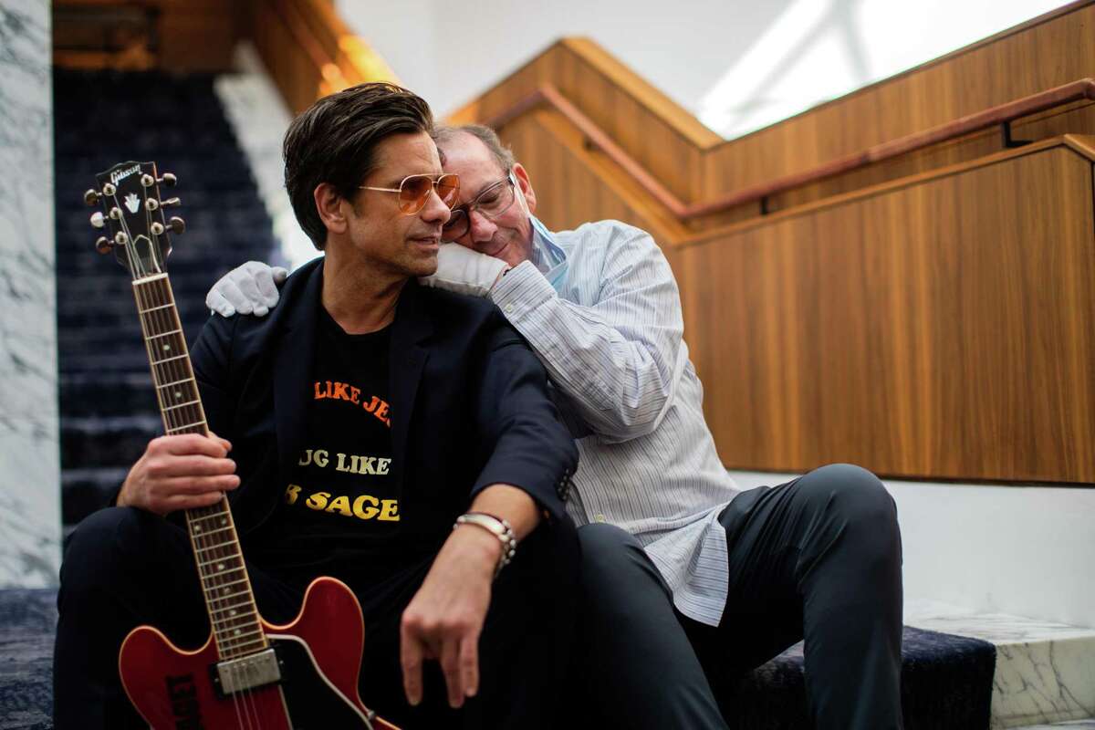 Actor and musician John Stamos, left, and his friend of many years Beach Boys musician Jeffrey Foskett, right, are in Houston to host MD Anderson’s 80th anniversary Celebration Concert, Wednesday, March 23, 2022, in Houston. Jeffrey Foskett is a rare survivor of anaplastic thyroid cancer.