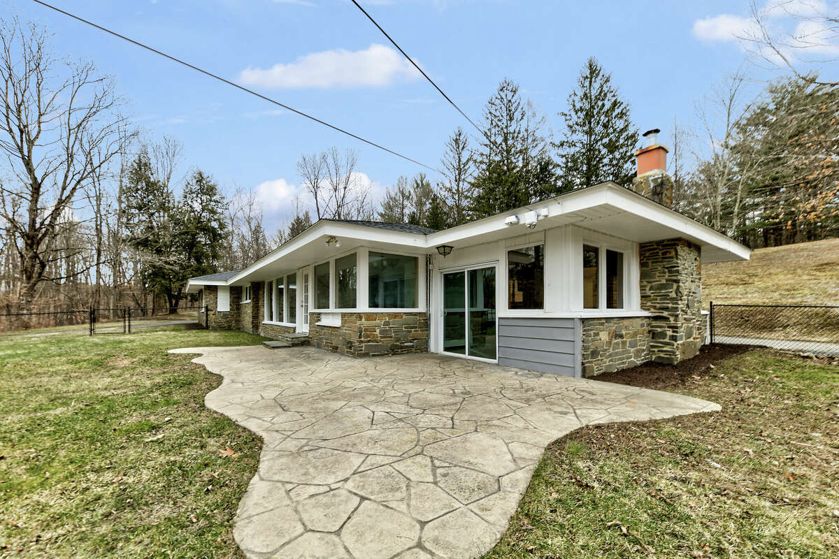 This week’s house is a ranch-style home on 99 acres in Nassau. The home at 54 Loweree Road was built in 1965 and has been partially renovated. It has a new roof, floor-to-ceiling windows, two fireplaces, four bedrooms and two bathrooms. There are steps from the kitchen to the enclosed porch. A stream runs through the property; there are two ponds, trails and a unique outbuilding on the lot. The owners built a glamping site on the property, a raised platform with a Bell-Tent and an outhouse and shower nearby. East Greenbush schools. Private septic and well. Taxes: $11,000. List price: $750,000. Contact listing agent Daniel Weinheimer of Vera Cohen Realty at 518-300-3265.