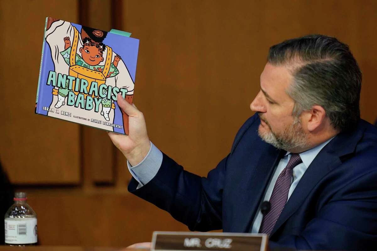 Sen. Ted Cruz, R-Texas, holds up a book as he questions Supreme Court nominee Judge Ketanji Brown Jackson during her confirmation hearing before the Senate Judiciary Committee Tuesday, March 22, 2022, on Capitol Hill in Washington. (AP Photo/Carolyn Kaster)