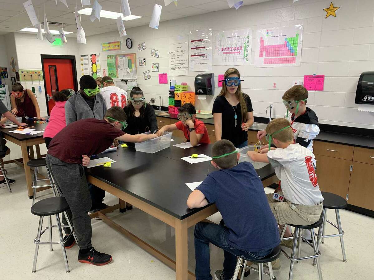 Debra Nolte's Hargrave High School AP Chemistry students teach a lesson to Huffman Middle School eighth graders before the pandemic. If voters approve the expansion bonds, both the middle school and high school will receive more room for collaborative efforts.