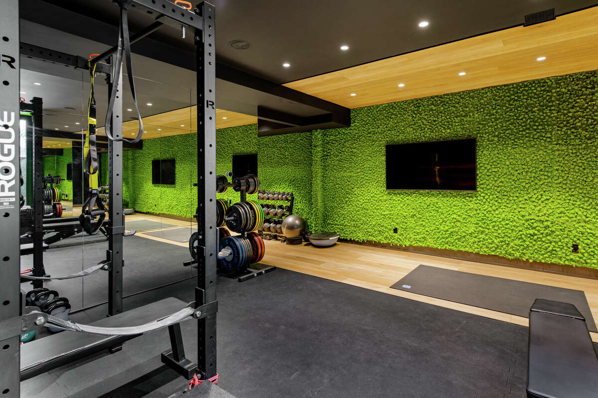 The gym in the home on 34 Beechcroft Road in Greenwich, Conn. has a "living wall" filled with plants. 