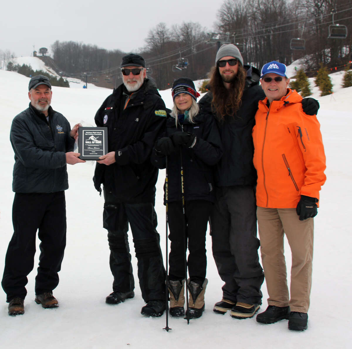 Shaun Johnson receives his MHSSCA Hall of Fame award at Crystal Mountain. (From left to right: Scott Papineau, Shaun Johnson, Chris Kitzman, Rory Johnson, and Steve Kermode.)