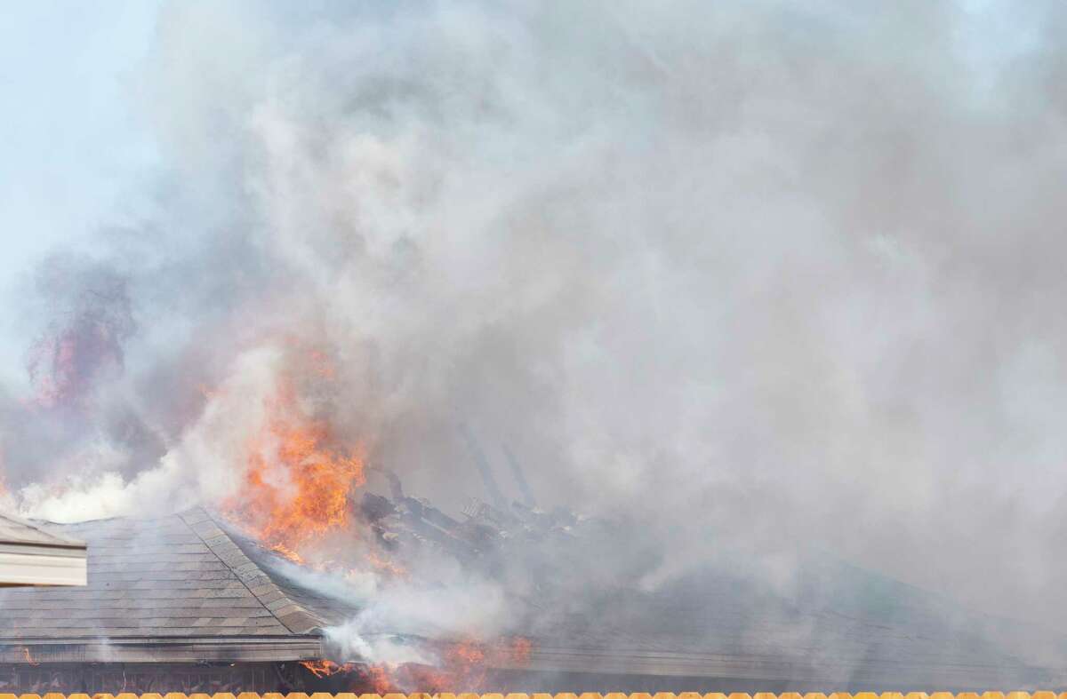 Midland firefighters battle a house fire 03/24/2022 that destroyed a home at 2604 Ringo Court, in northeast Midland. Tim Fischer/Reporter-Telegram