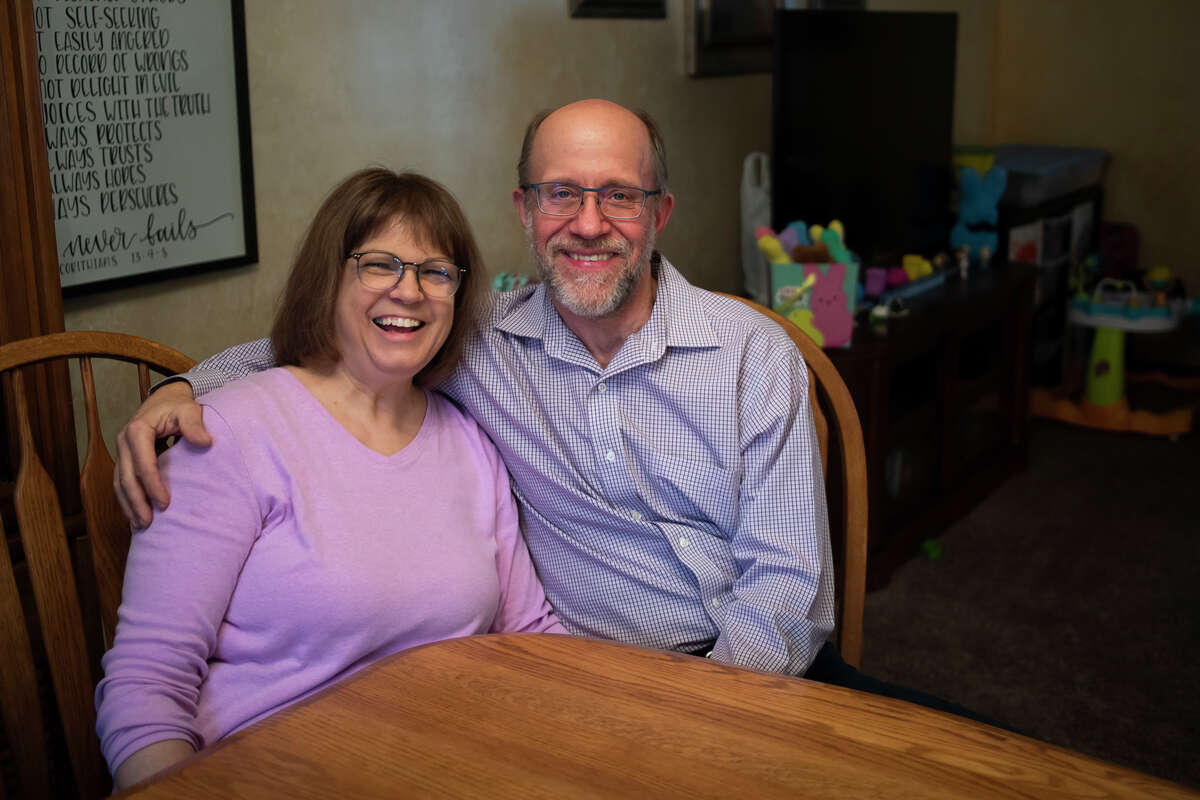 Kathy Biskupski, left, and her husband Tony Biskupski, right, sit together at their home in Midland, where they have hosted many Great Lakes Loons players over the years.
