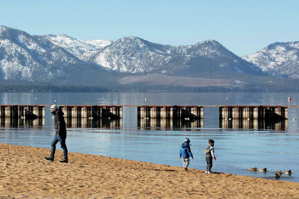 A family enjoys Lakeside Beach in South Lake Tahoe, Calif. The Tahoe region could see record-setting heat in the coming days.