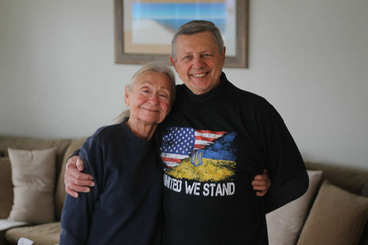 Gene Riabucha and his wife, Janice, pose for a photo in their Manistee home. Riabucha and his family fled Ukraine to escape Russian oppression and eventually came to the United States in 1949.