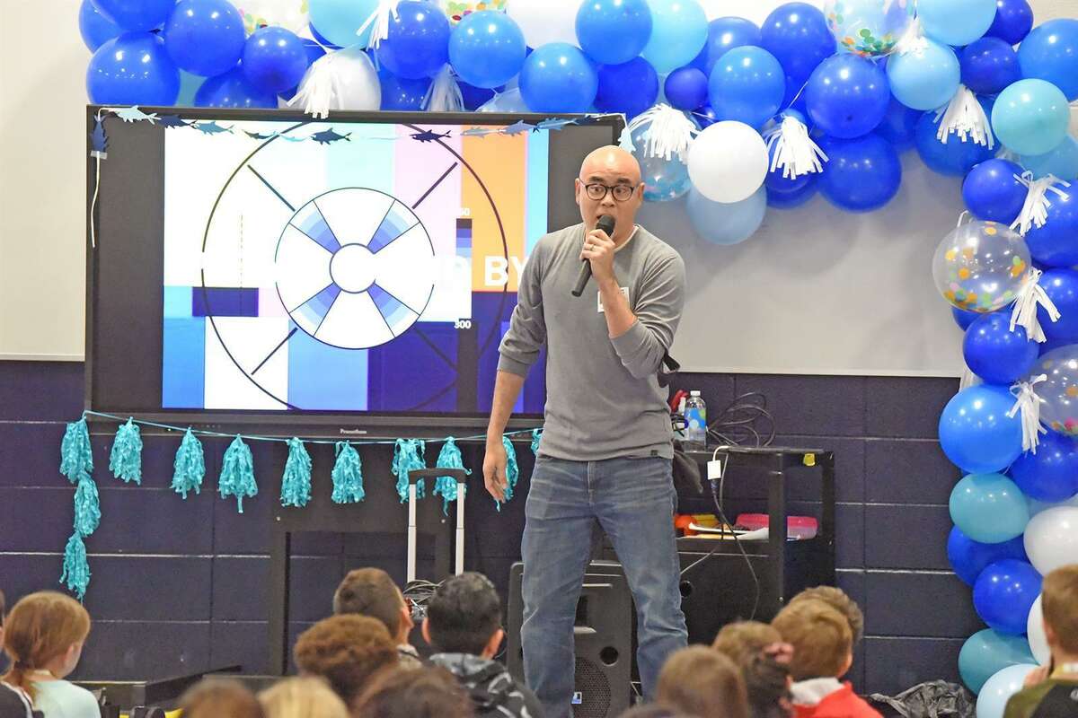 Author and illustrator Dan Santat, the 2015 Randolph Caldecott Medal recipient for that year’s most distinguished American picture book for children, visits with Hamilton Elementary School third grade students on March 7. The in-person visit was the school’s first since the 2019-2020 school year. Santat promoted his newest graphic novel, The Aquanaut.