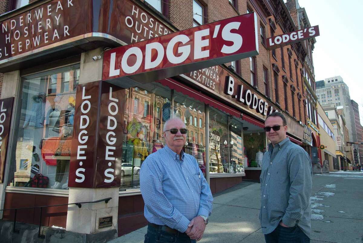 Jack Yonally, left, former president of B. Lodge & Co., and his son, Mark Yonally, president of B. Lodge & Co., pose for a photo outside the store Monday, March 14, 2022, in Albany, NY