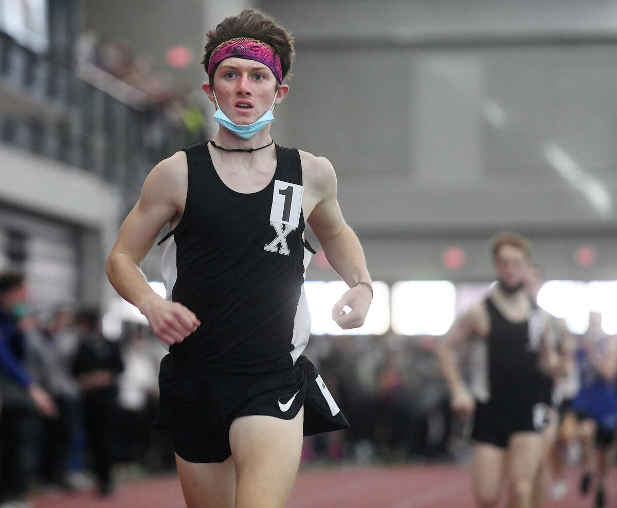 Xavier's Eamon Burke races to victory in the 1000 meters with a time of 2:37.97 at the Class L Track Championships at the Floyd Little Athletic Center in New Haven, Conn. on Saturday, February 12, 2022.