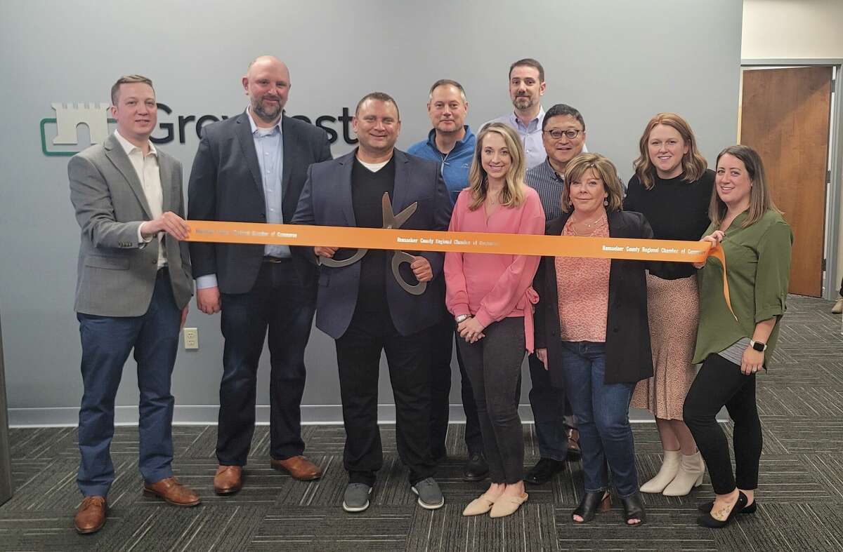 GreyCastle Security team members cut the ribbon to their new office in the Rensselaer Technology Park alongside local leaders on March 24, 2022. 