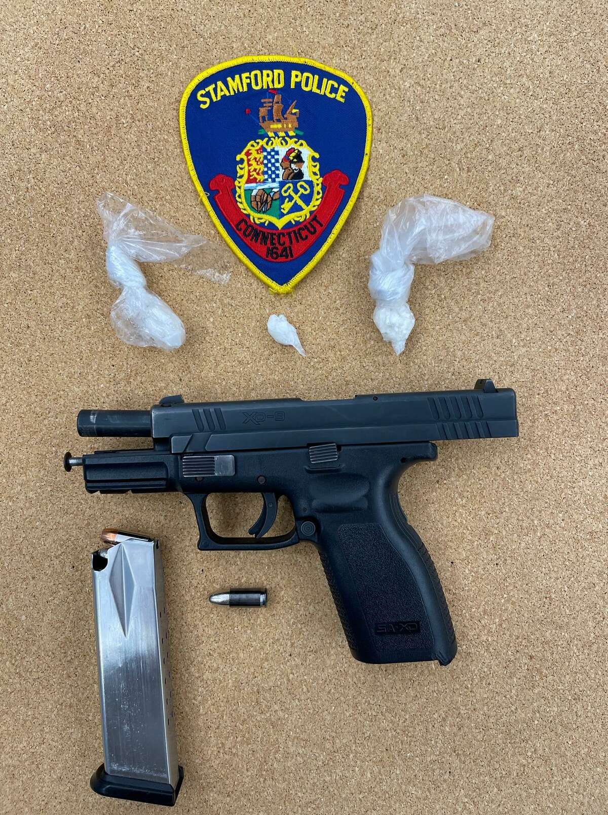 Stamford police said they recovered a loaded handgun with an illegal extended magazine and 6.5 grams of crack cocaine during a planned bust on Thursday, March 24, 2022.