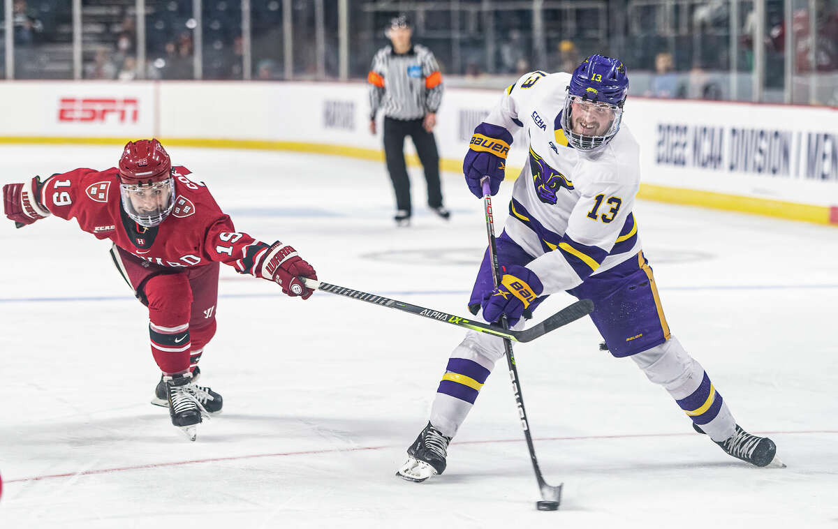 Minnesota State's Brendan Furry takes a shot in front of Harvard's Matthew Coronato  in the NCAA East Regional at MVP Arena on Thursday, March 24, 2022.