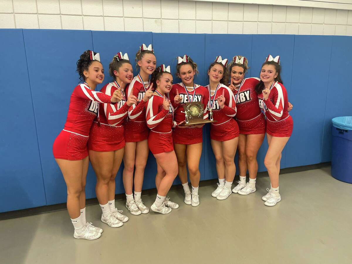 The Derby High School cheerleading team celebrates after winning the Regional New England Spirit Championship Division 4 title on March 19, 2022 at Worcester State University in Worcester, Mass.