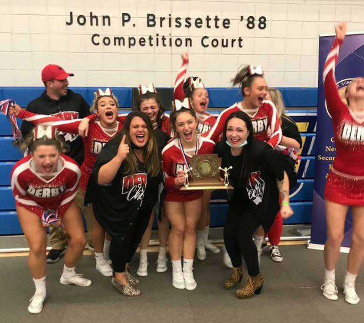 The Derby High School cheerleading team celebrates after winning the Regional New England Spirit Championship Division 4 title on March 19, 2022 at Worcester State University in Worcester, Mass.