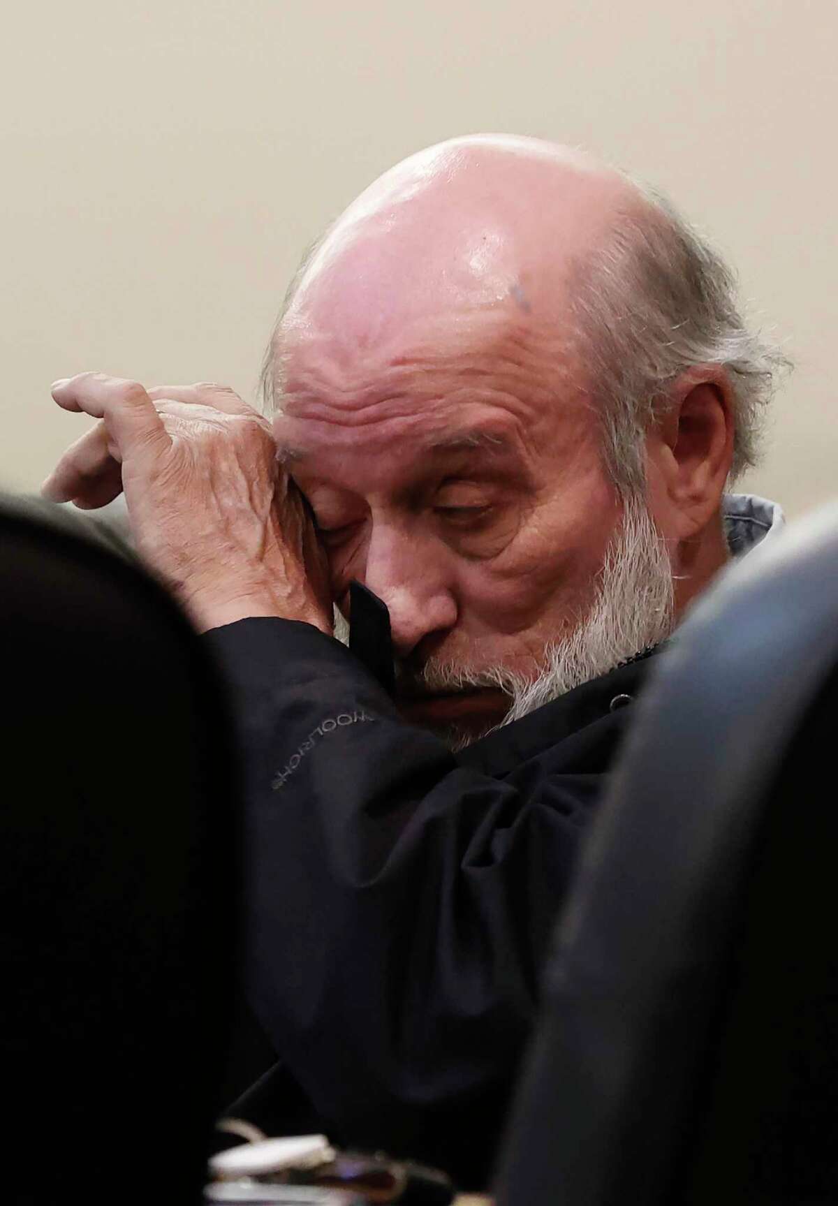 Larry Leroy Moore clears his eye as testimony continues on the third day of his capital murder trial in the 175th District Court on Thursday. Moore is accused of raping and killing Dianna Lowery, 25, in San Antonio on Jan. 29, 1987.