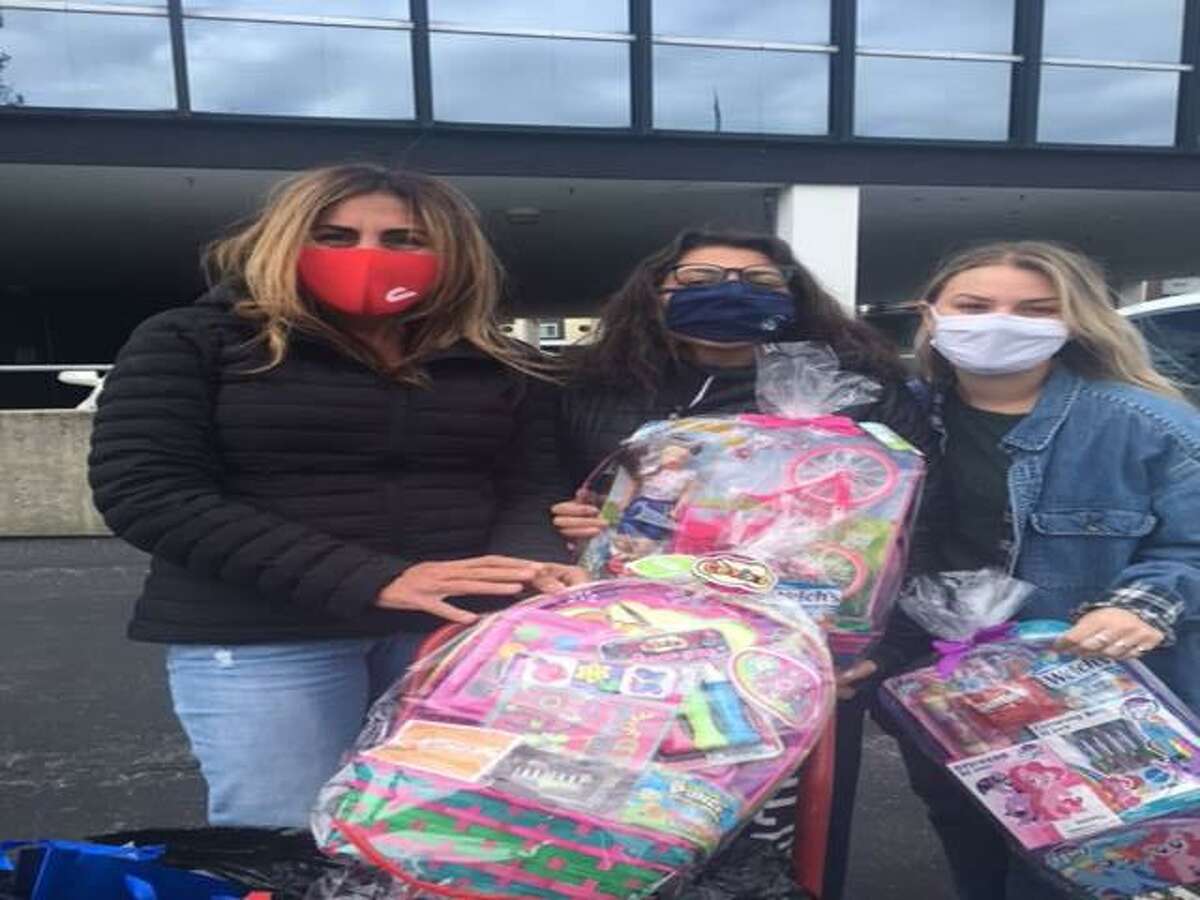 The DiMatteo family will be continuing its more than 20-year annual tradition of assembling and distributing Easter Baskets to homeless shelters in the region. This year’s community drive is being organized by Jessica DiMatteo of Bethany, center, a third-generation family member, who is affiliated with the DiMatteo Group Financial Services in Shelton. Pictured during last year's drive are DiMatteo and her mother, Kim DiMatteo of Bethany, left, and her friend Nicole Kelley of Guilford, right.