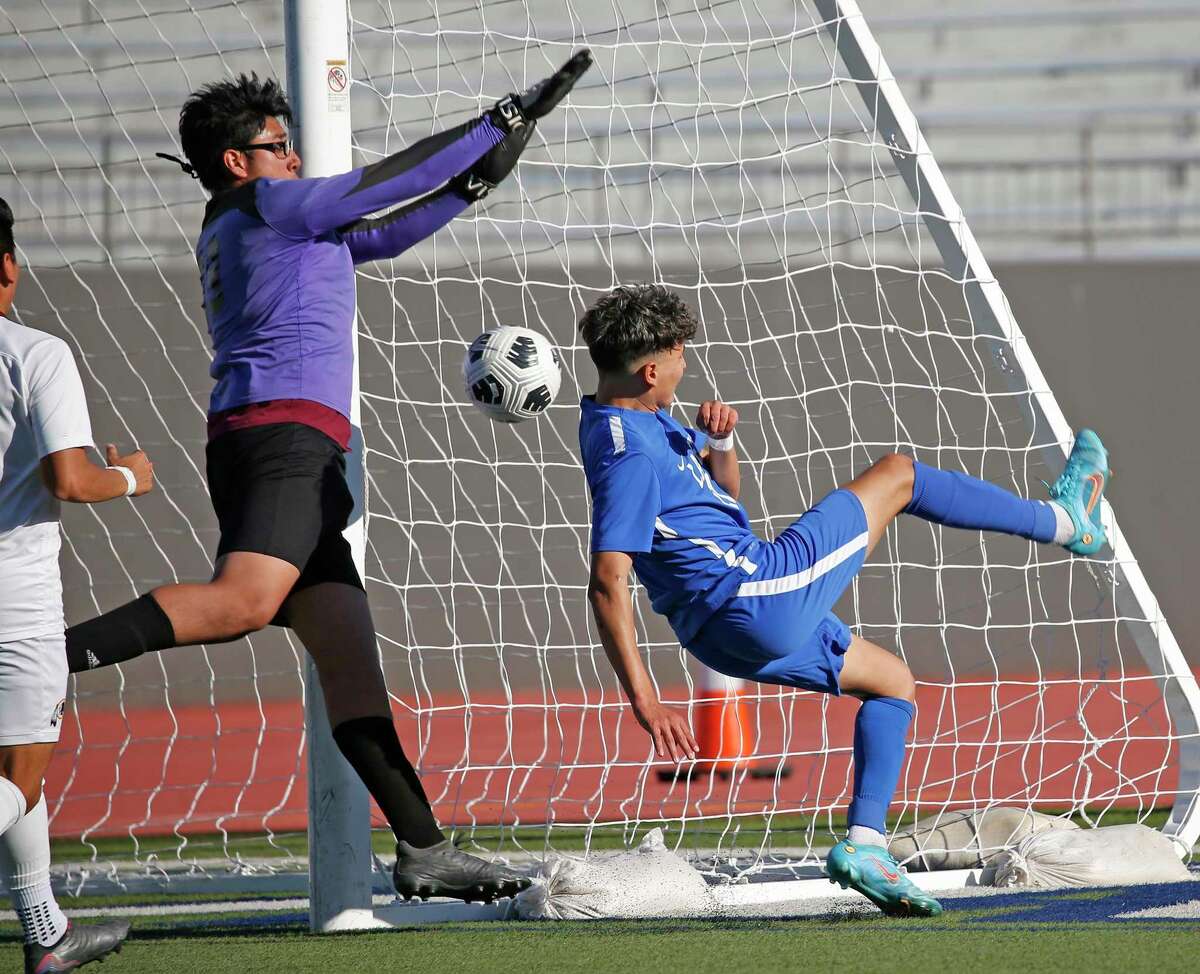 Harlandale goalie Alfonso Acosta (99) prevents Lanier Alberto Ortiz (11) from scoring. Class 5A first-round boys soccer playoff - Harlandale vs. Lanier on Thursday, March 24,2022