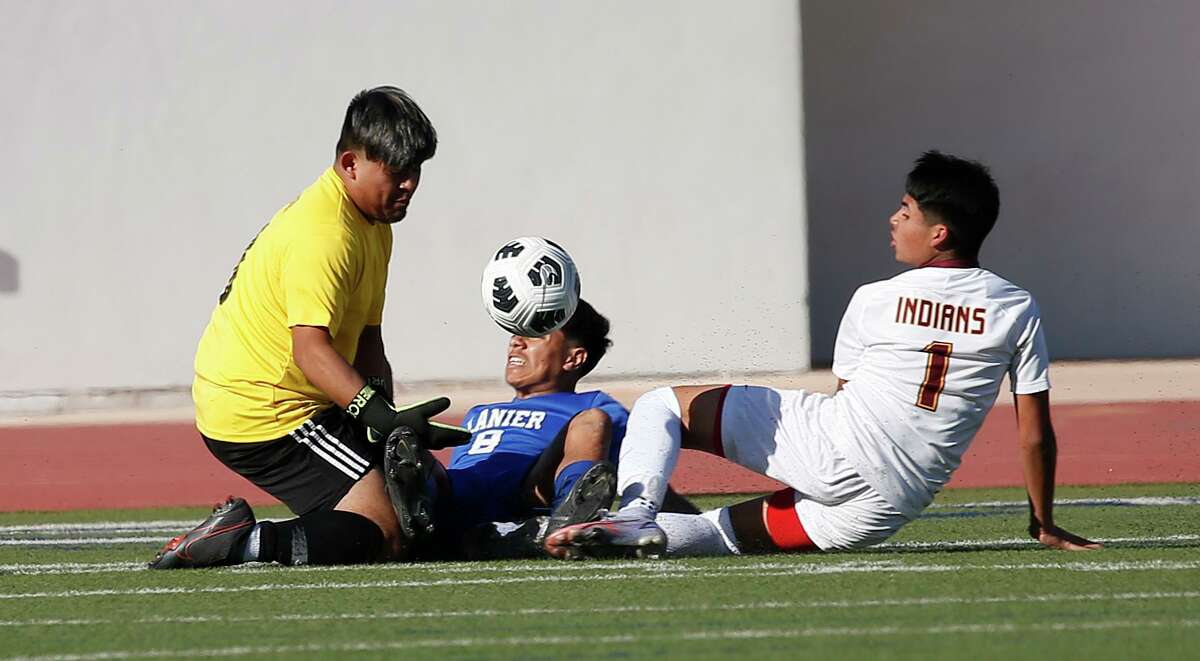 Lanier goalie Juan Rosas (1) gets help from Lanier Jose Luis Rodriguez Felix (8) stopping Harlandale Jared Garcia (1). Class 5A first-round boys soccer playoff - Harlandale vs. Lanier on Thursday, March 24,2022