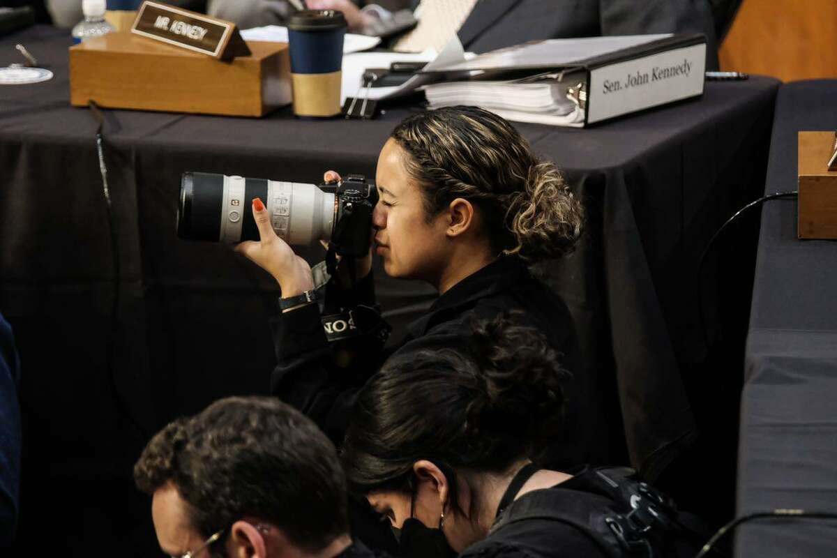 Sarahbeth Maney, an Oakland native, takes photos during the Ketanji Brown Jackson confirmation hearings.