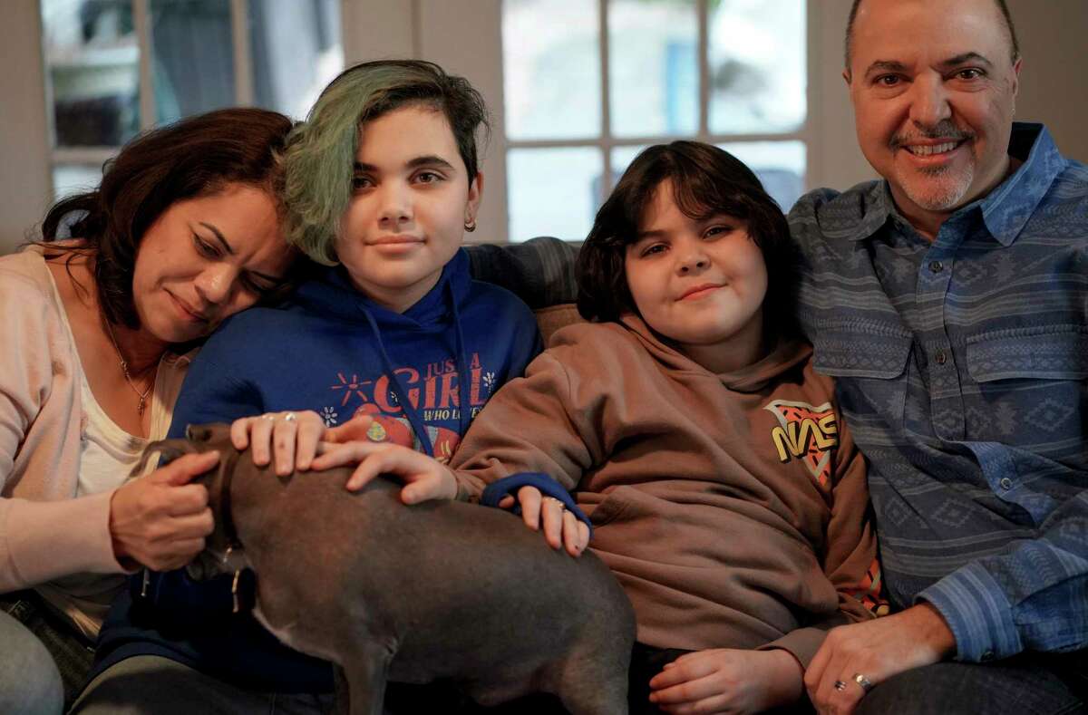 Camille, Alexandra, Leon and Homero Rey at home on March 10, 2022 in Potomac, Md. Leon, 9, is transgender and his family moved from Texas to protect his rights.