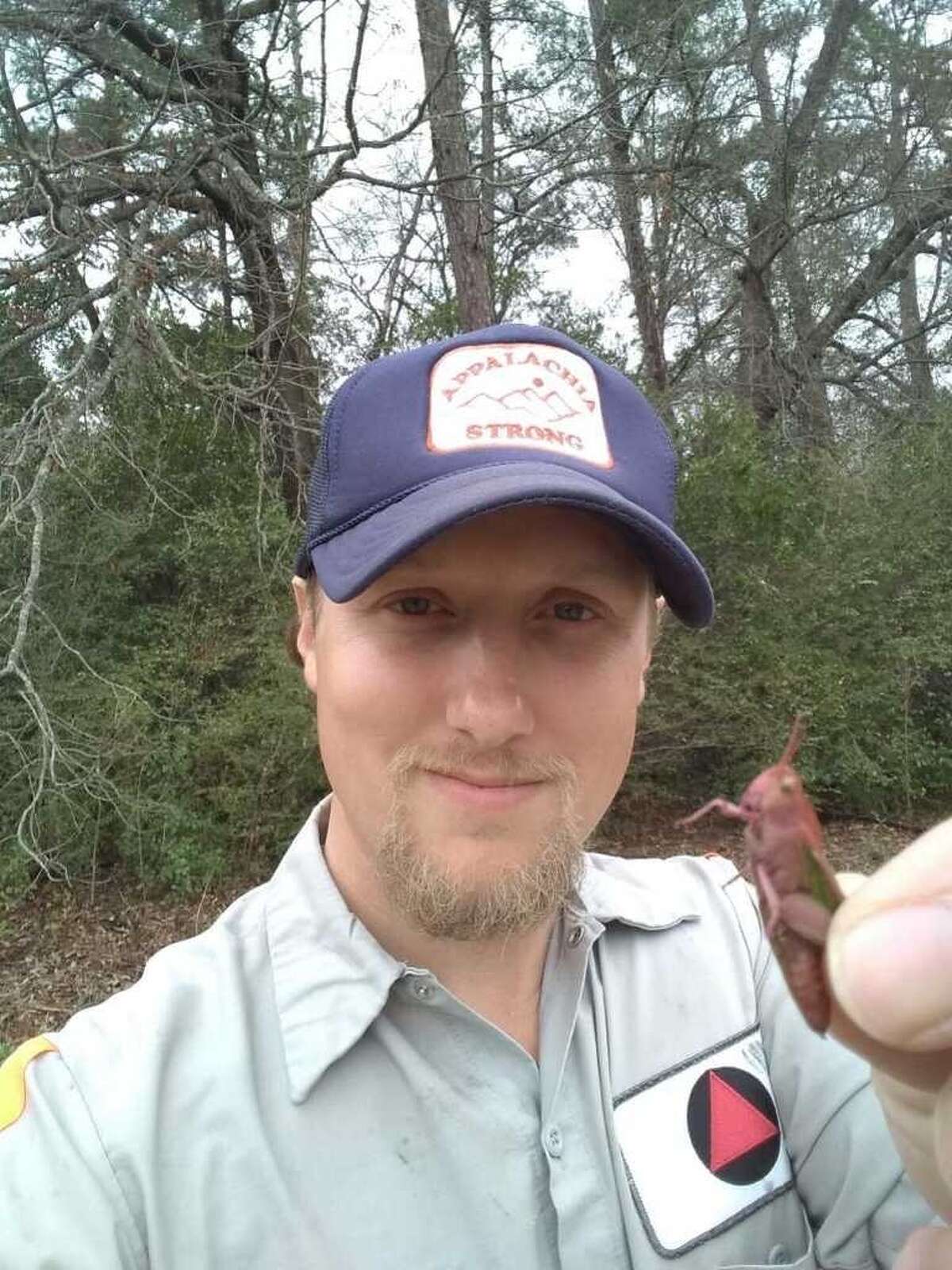 Dirk Parker, an Ohio man working in East Texas, found a rare pink grasshopper while exploring nature. 