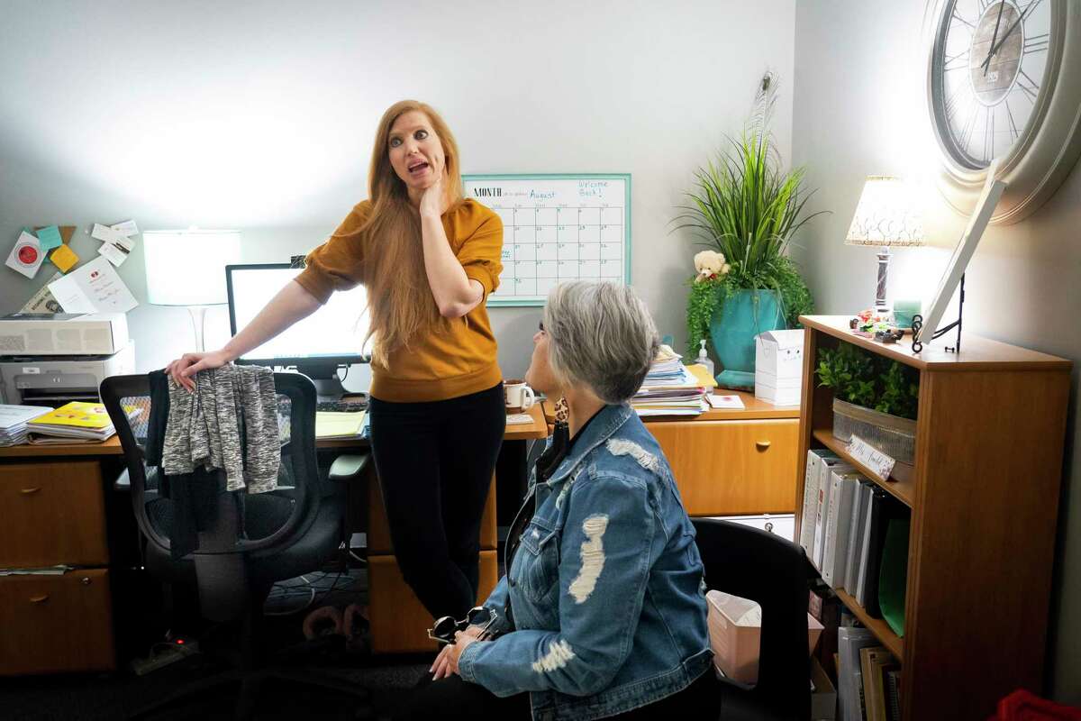 Melissa Arnold, a counselor at Stewart Elementary School in Hitchcock, speaks with Vickie Rabino, the district’s crisis counselor, in Arnold’s office.