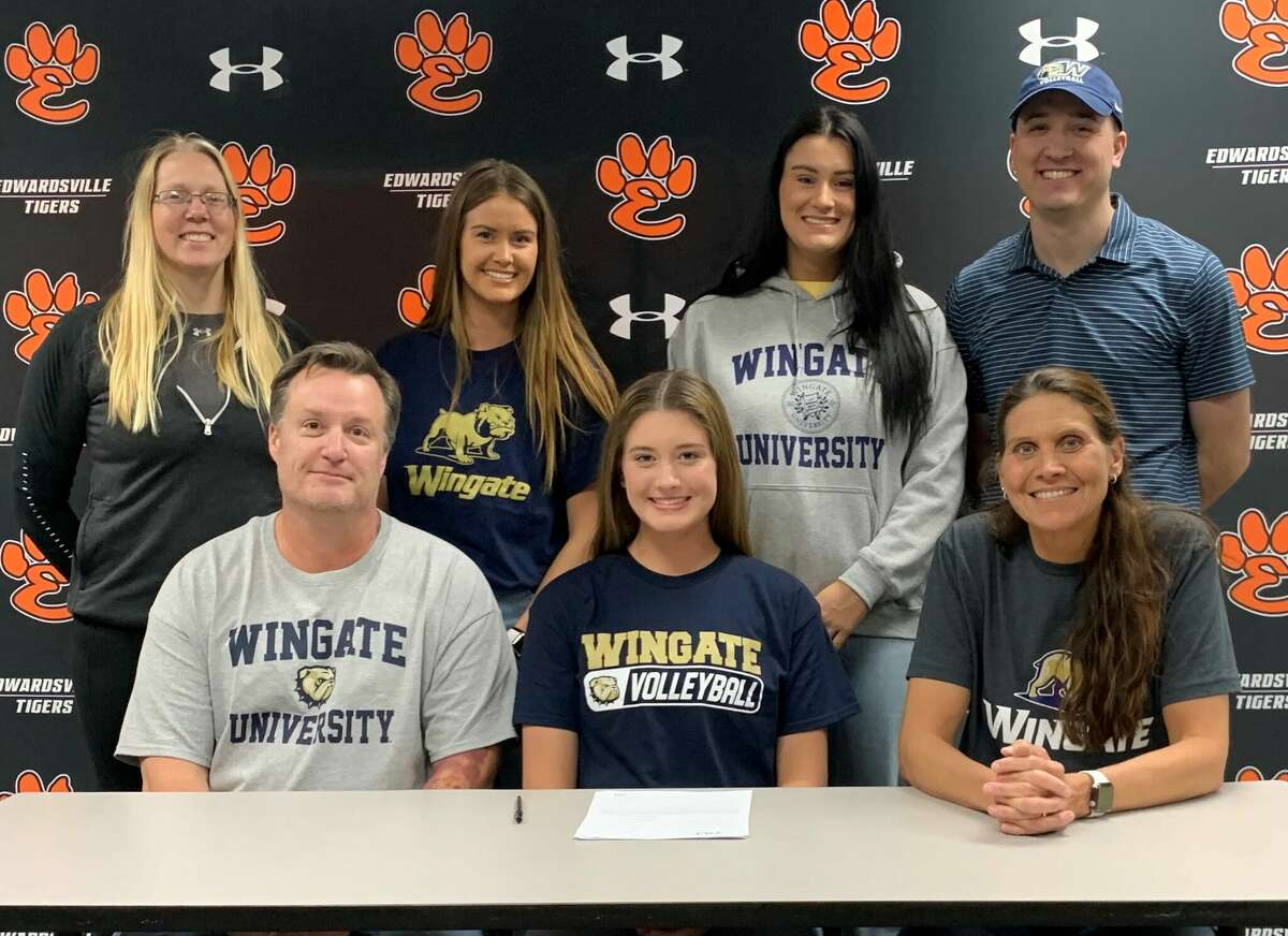 Edwardsville senior Gabby Saye, seated center, will play college volleyball for Wingate University in North Carolina. She is joined in the picture by her family and EHS coach Heather Ohlau.