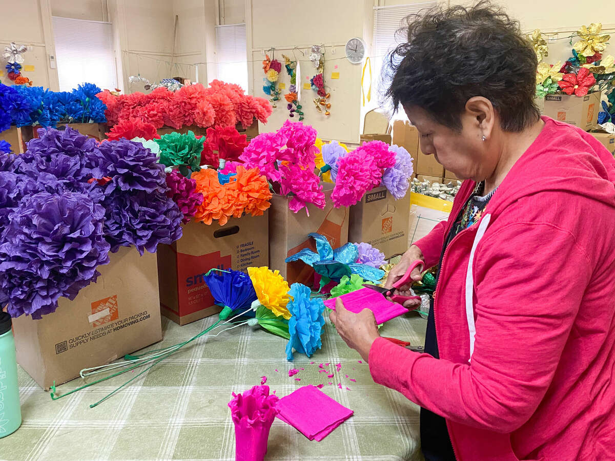 Rose Garcia demonstrates the flower-making process that's been passed down since the early 1900s. 