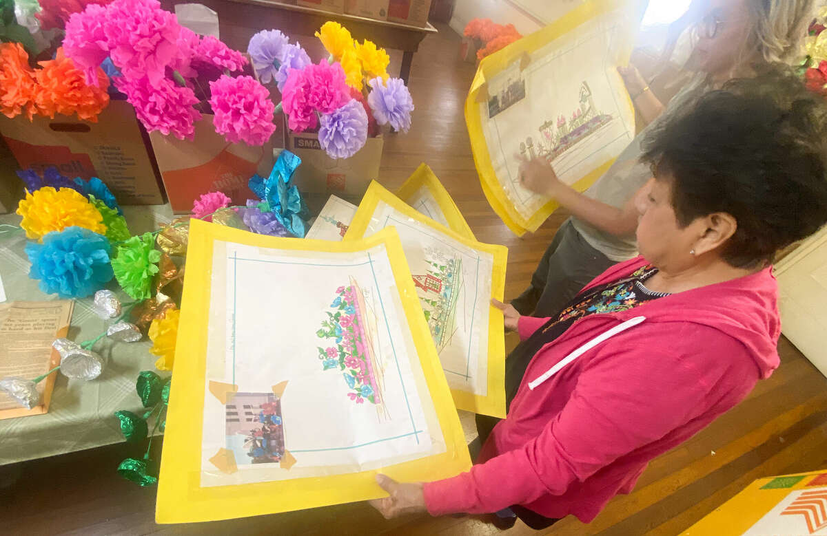 Rose Garcia looks at float designs from previous Fiesta years. 