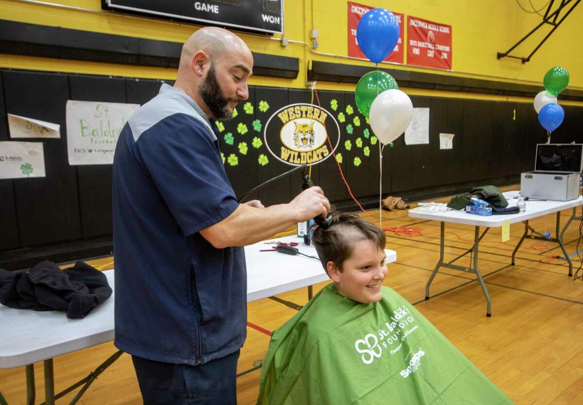 Lake Sisca is the first to lose hair at the 2022 St. Baldrick’s fundraiser Thursday, March 24, 2022, at Western Middle School.