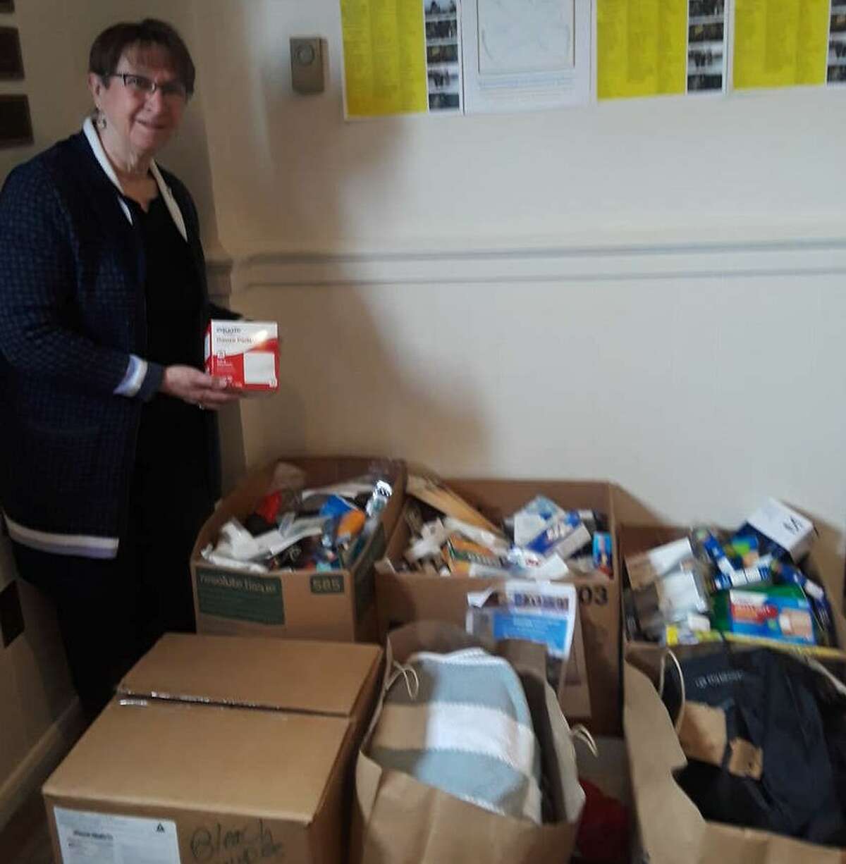 Clare Carroll, All Saints parishioner, organizes medical supplies collected for Ukrainian relief. The Albany church is hosting a Sunday service of music, prayer, Ukrainian poems shared in English and donation collection on Sunday, March 27.