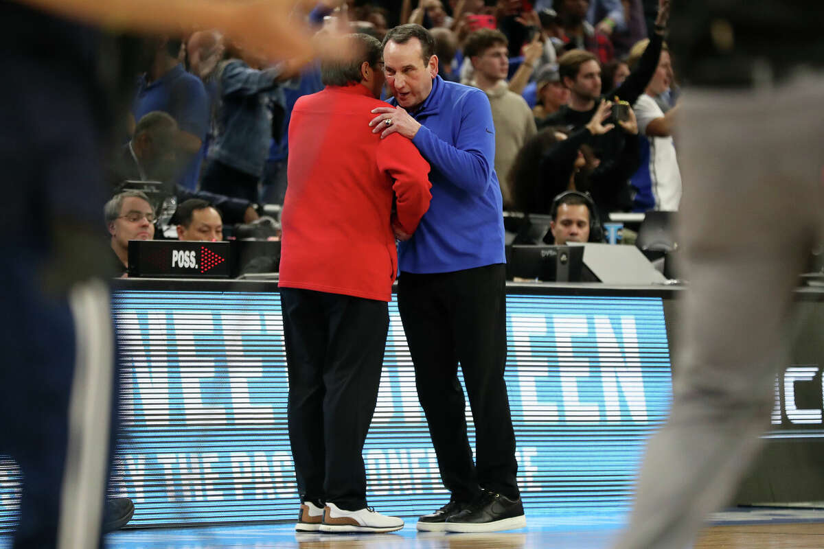 Duke head coach Mike Krzyzewski talks with Texas Tech head coach Mark Adams after Duke's 78-73 win in NCAA Men's Basketball West Regional semifinal at Chase Center in San Francisco, Calif., on Thursday, March 24, 2022.