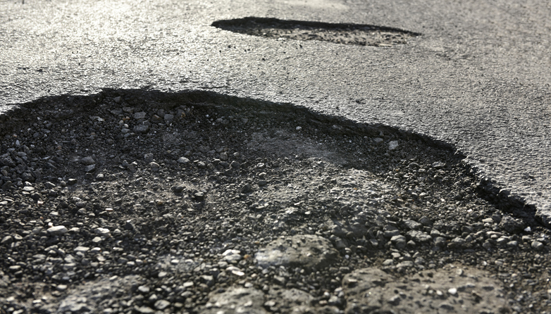 Potholes plaguing drivers along heavily traveled Cass road - Vimarsana News