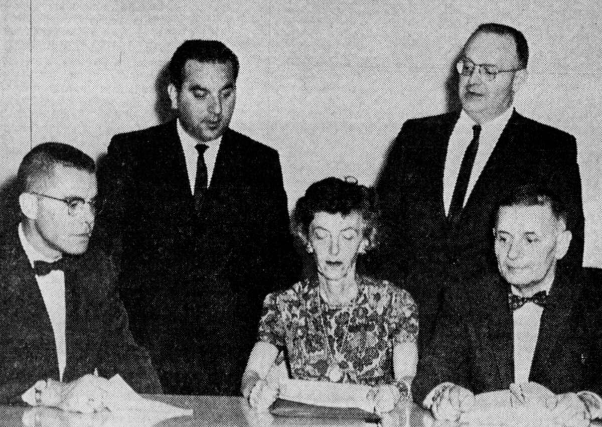 (From left, seated) Malcolm Young, Mrs. George Hunt, and Dr. Joseph Venier; standing, Dan Stango and Robert Morton could be seen at the annual meeting of the Manistee County Chapter of the Red Cross on the night of March 27, 1962. The photo was published in the News Advocate on March 28, 1962.