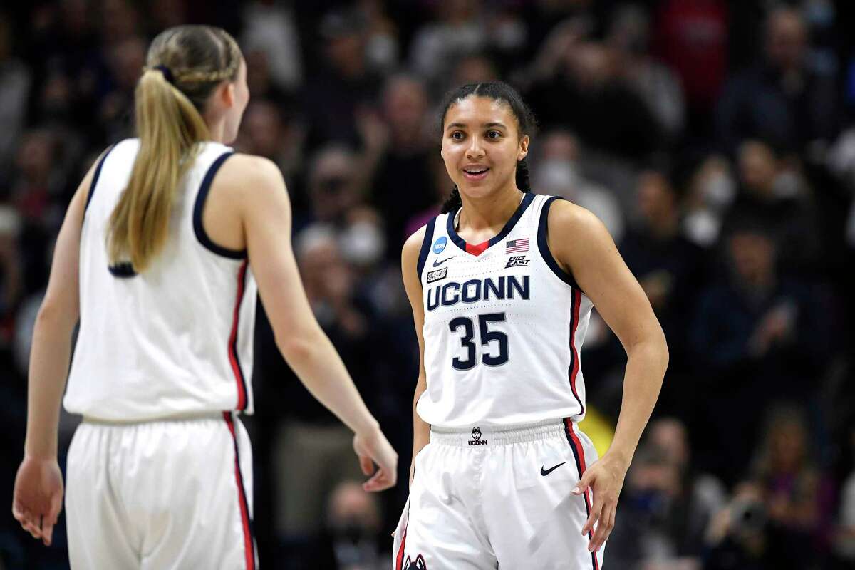 Connecticut's Paige Bueckers, left, and Connecticut's Azzi Fudd during the first half of a second-round women's college basketball game in the NCAA tournament, Tuesday, March 22, 2022, in Storrs, Conn. (AP Photo/Jessica Hill)