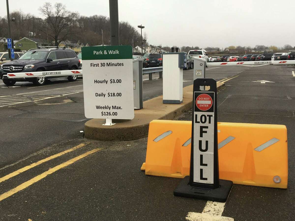 The entrance to the Park-and-Walk parking lot at Tweed New Haven Regional Airport sports a “LOT FULL” sign March 24, 2022.
