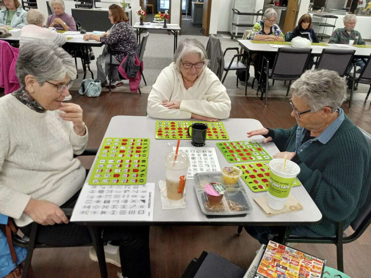 The Sullivan Senior Center has resumed many of its activities and added new ones, welcoming members and newcomers for meals, events and companionship. From left, Jackie Roger, Rayelene Koontz and Janice Capolupo play bingo.