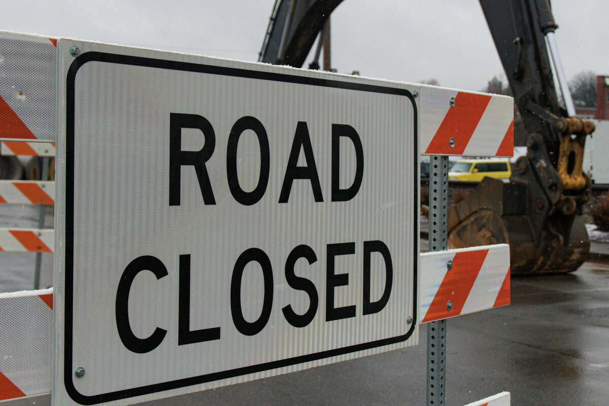 A striped road closed sign.