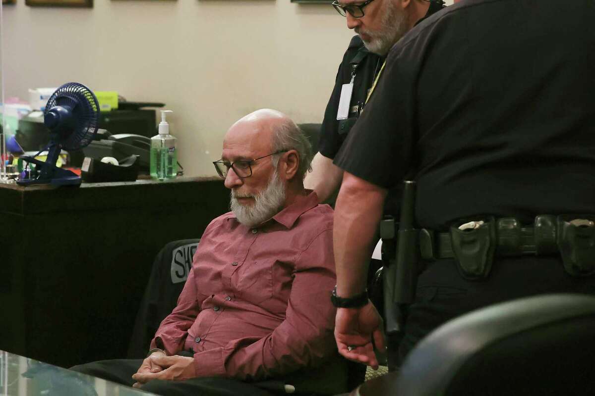 Larry Leroy Moore is led away in handcuffs after he is found guilty on capital murder charges in the Bexar County 175th District Court, Friday, March 25, 2022. Moore was sentenced to life without the possibility of parole for the murder, kidnapping and rape of Dianna Lowery on January 29, 1987. Due to sentencing guidelines at the time of the murder, he will be eligible for parole in 40 years.