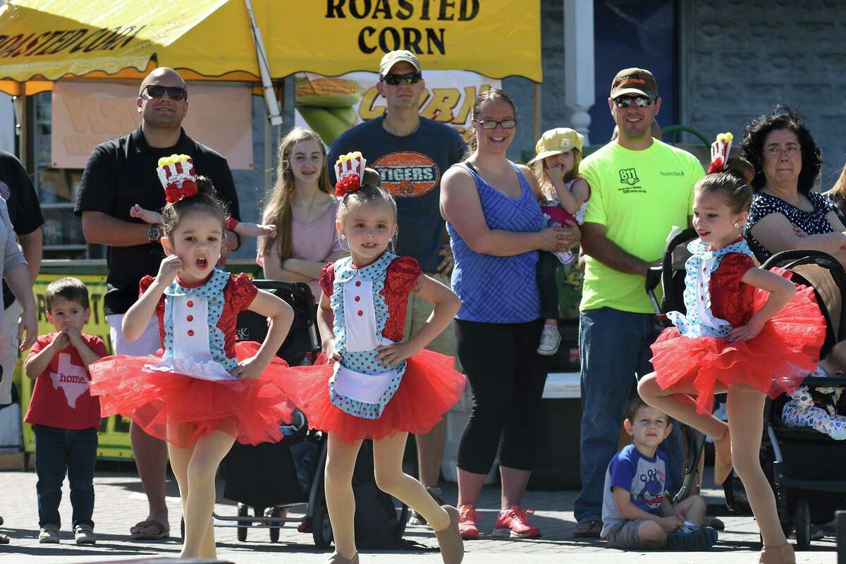 Charlotte Ramirez, from left, Abby Waldrop, and MacKenzie Guilt, all from the Minis team at Profusion Performing Arts in Atascocita, dance for the crowd during the Good Oil Days event in downtown Humble on April 8, 2017. This year’s festival is Saturday, April 2 from 10 a.m. to 5 p.m. on Main Street in downtown.