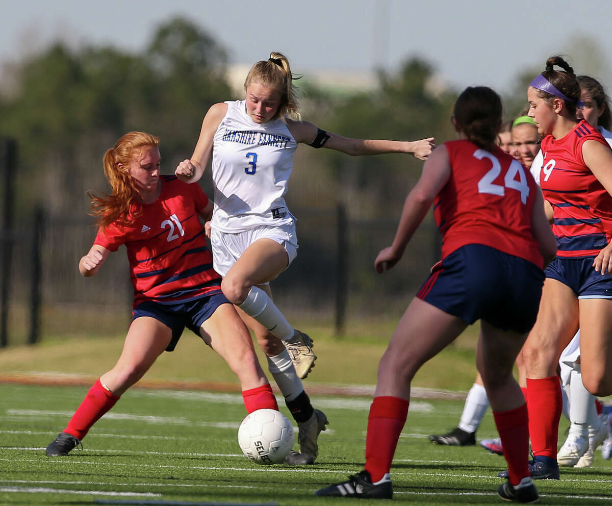 Riley Leger (3) fights to take the ball from Keira Hemmert (21) in Friday's playoff game. Photo taken by Jarrod Brown on March 25, 2022 in Beaumont, TX