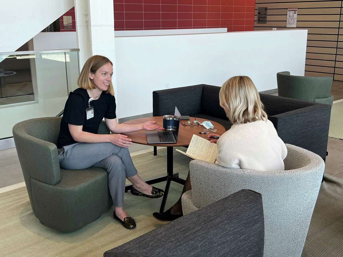 Stephanie Leonard (left) is lead author of a study in the American Journal of Obstetrics and Gynecology showing that two-mother couples have more complications during birth than mother-father couples. The Stanford University School of Medicine instructor meets with a colleague on campus.