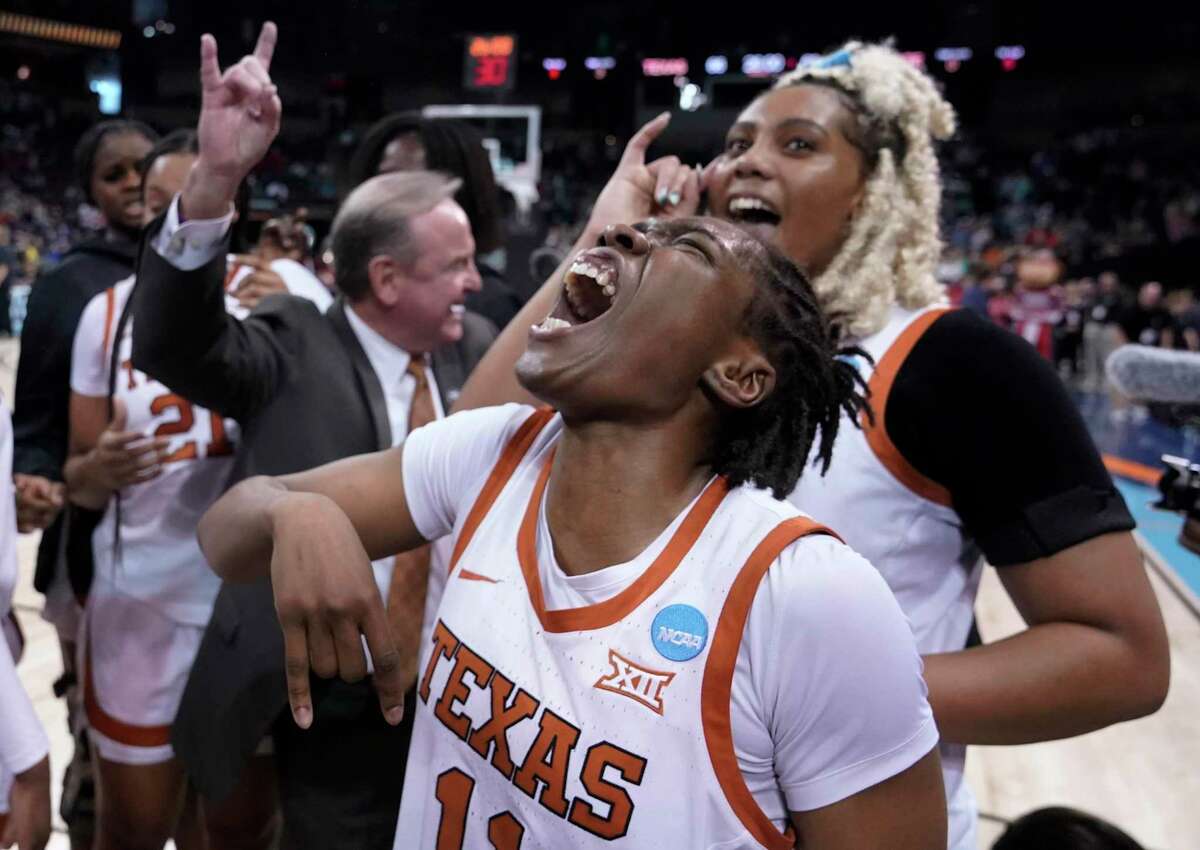 Texas guard Joanne Allen-Taylor, center, reacts after Texas beat Ohio State 66-63 in a college basketball game in the Sweet 16 round of the NCAA tournament, Friday, March 25, 2022, in Spokane, Wash. (AP Photo/Ted S. Warren)