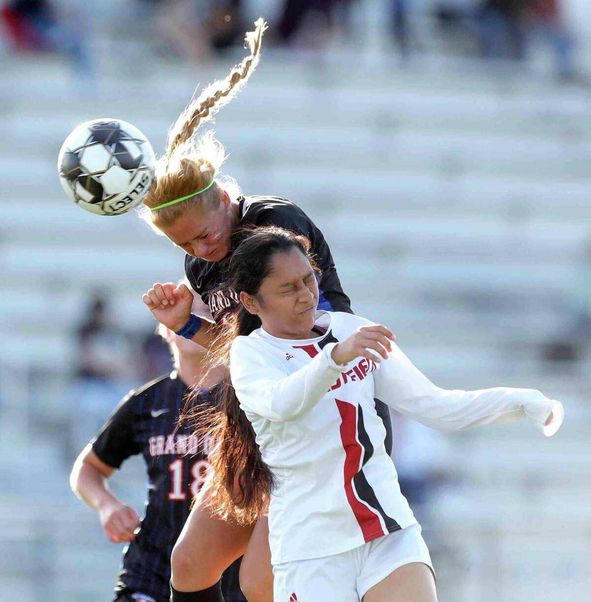 Grand Oaks' Jorja Bragg (17) heads the ball past Westfield's Jasmin Benitez (11) toward the goal during the first period of a Region II-6A bi-district high school soccer match at Grand Oak High School, Friday, March 25, 2022, in Spring.