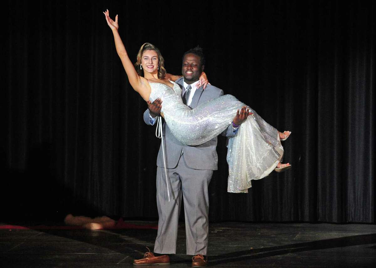 Stamford High School seniors Walker Luncy and Madeline Maxfield model prom fashion during the school's 34th annual