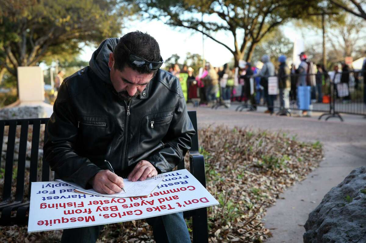 Hugo Osornio, an oyster fisherman, prepares his talking points before a Texas Parks and Wildlife commission meeting Thursday, March 24, 2022, at the TPWD headquarters in Austin. TPWD had sought to close three public reefs to oyster harvesting because of declining oyster populations, and the fishermen protested those closures. “It’s all I can do,” said Osornio. He also said he couldn’t imagine telling his son that he can’t afford his university tuition because he lost his ability to fish.