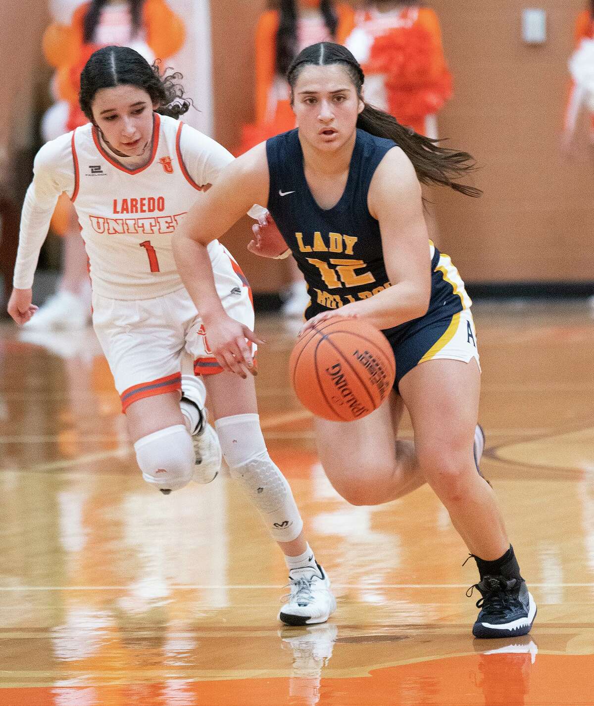 United High School Jesslynn Jalomo chases after Alexander High School Kayla Herrera as she moves the ball down the court Friday, Jan. 14, 2022 at United High School.