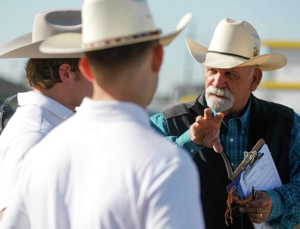Judge Karl Collins peppers Splendora High School students with question about their 12-foot trailer at the agriculture mechanic show during the Montgomery County Fair and Rodeo, Saturday, March 26, 2022, in Conroe.